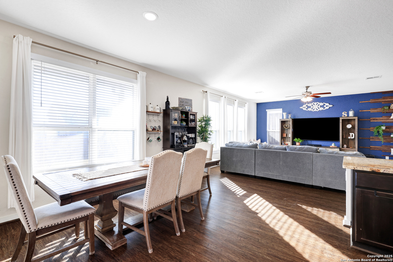 10614 Rosalina Loop Converse, TX 78109 - Photo 9 of 31 a living room with furniture a flat screen tv and a large window