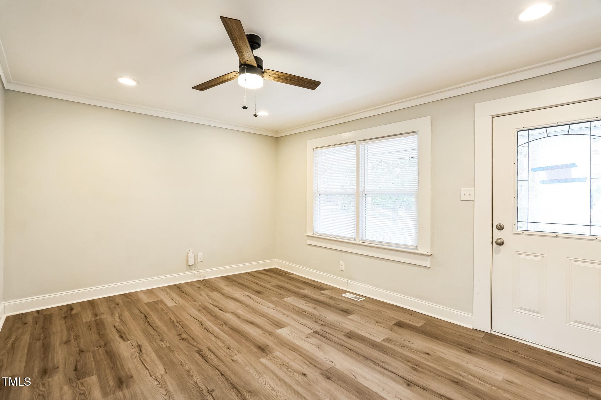 2400 Dorety Place Raleigh, NC 27604 - Photo 11 of 29 wooden floor in an empty room with a window