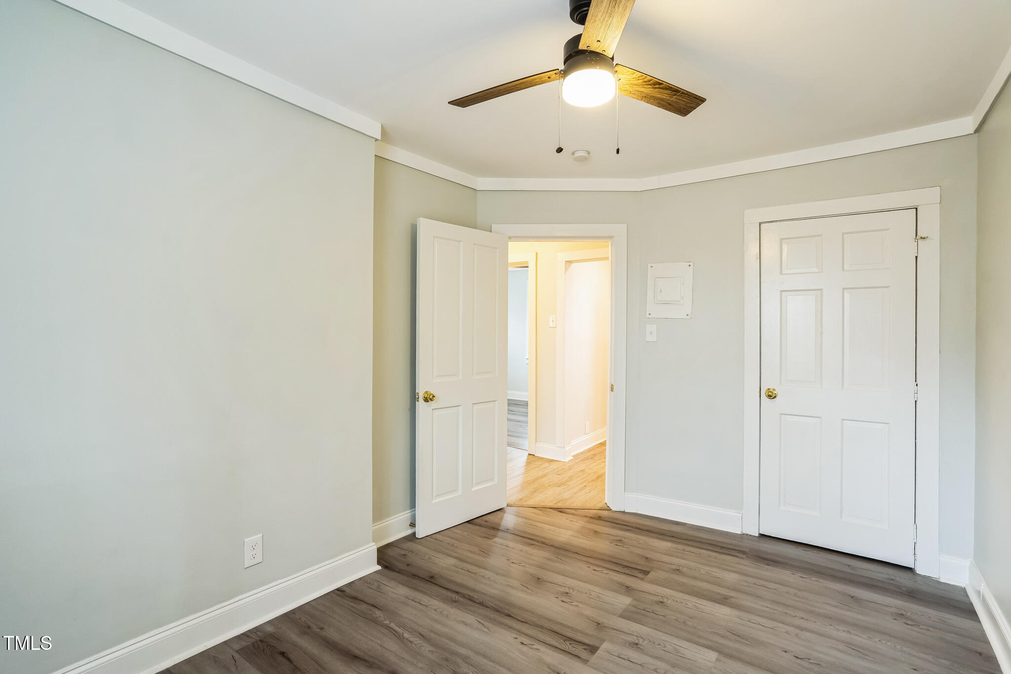 2400 Dorety Place Raleigh, NC 27604 - Photo 13 of 29 an empty room with wooden floor and a ceiling fan