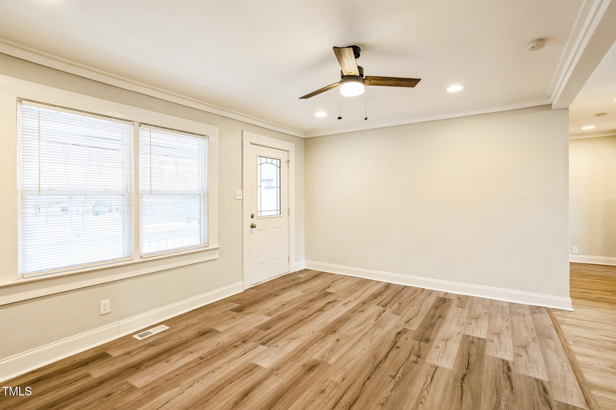 2400 Dorety Place Raleigh, NC 27604 - Photo 17 of 29 a view of empty room with wooden floor and fan