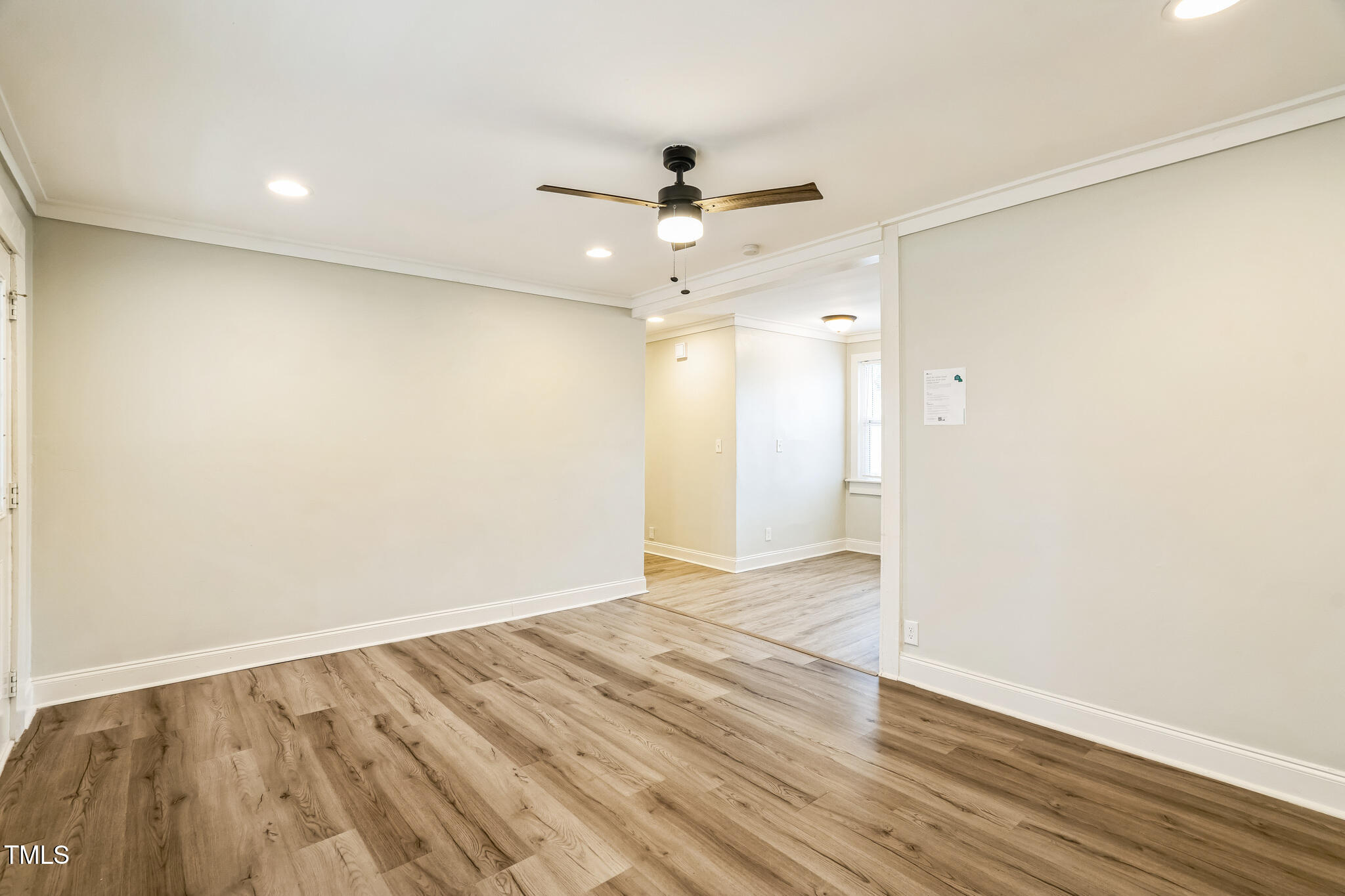 2400 Dorety Place Raleigh, NC 27604 - Photo 18 of 29 an empty room with wooden floor and a ceiling fan
