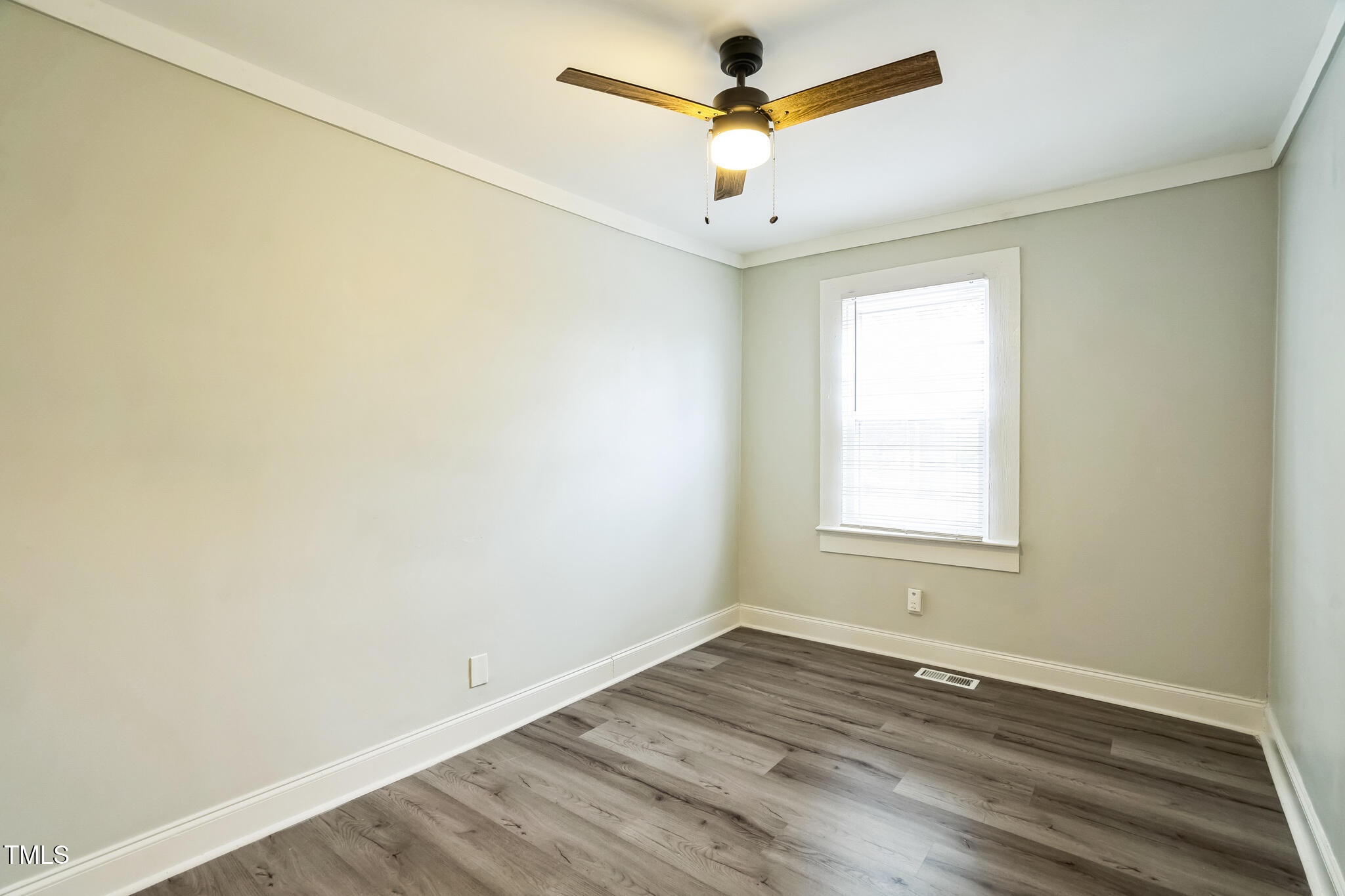 2400 Dorety Place Raleigh, NC 27604 - Photo 23 of 29 an empty room with a window and a ceiling fan