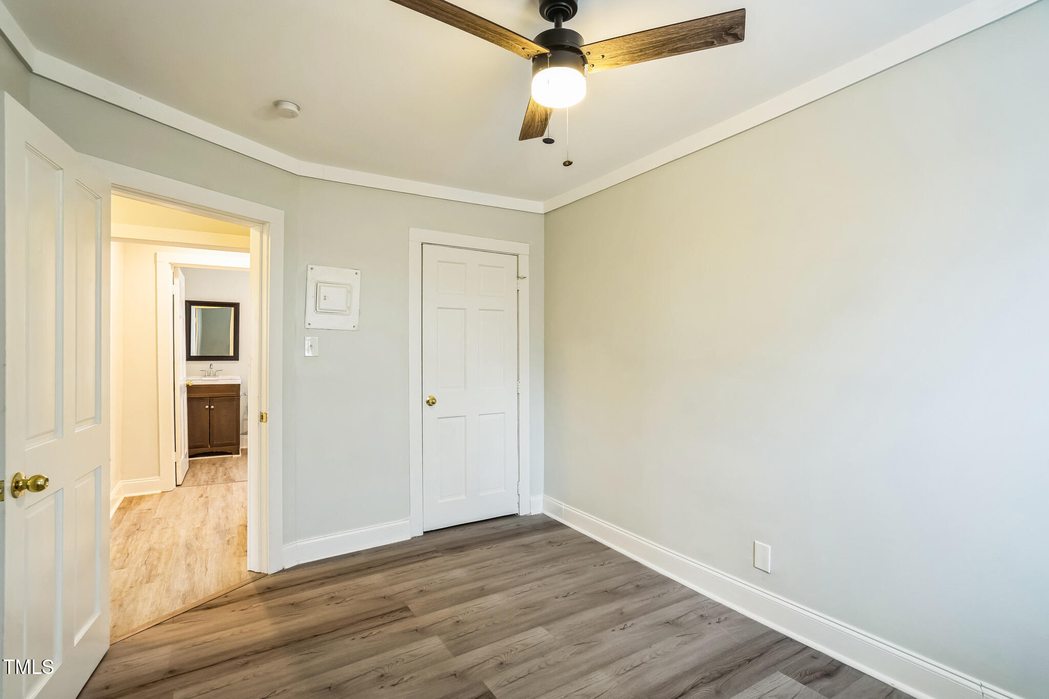 2400 Dorety Place Raleigh, NC 27604 - Photo 26 of 29 a view of a room with wooden floor and a ceiling fan