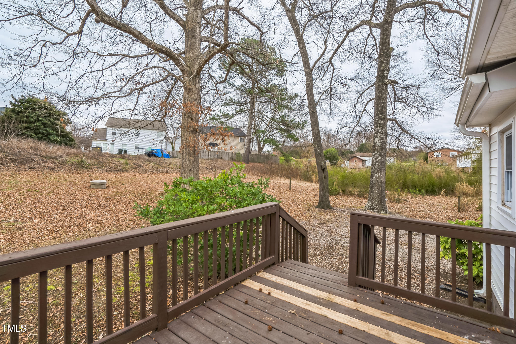 2400 Dorety Place Raleigh, NC 27604 - Photo 3 of 29 a view of a wooden balcony and trees