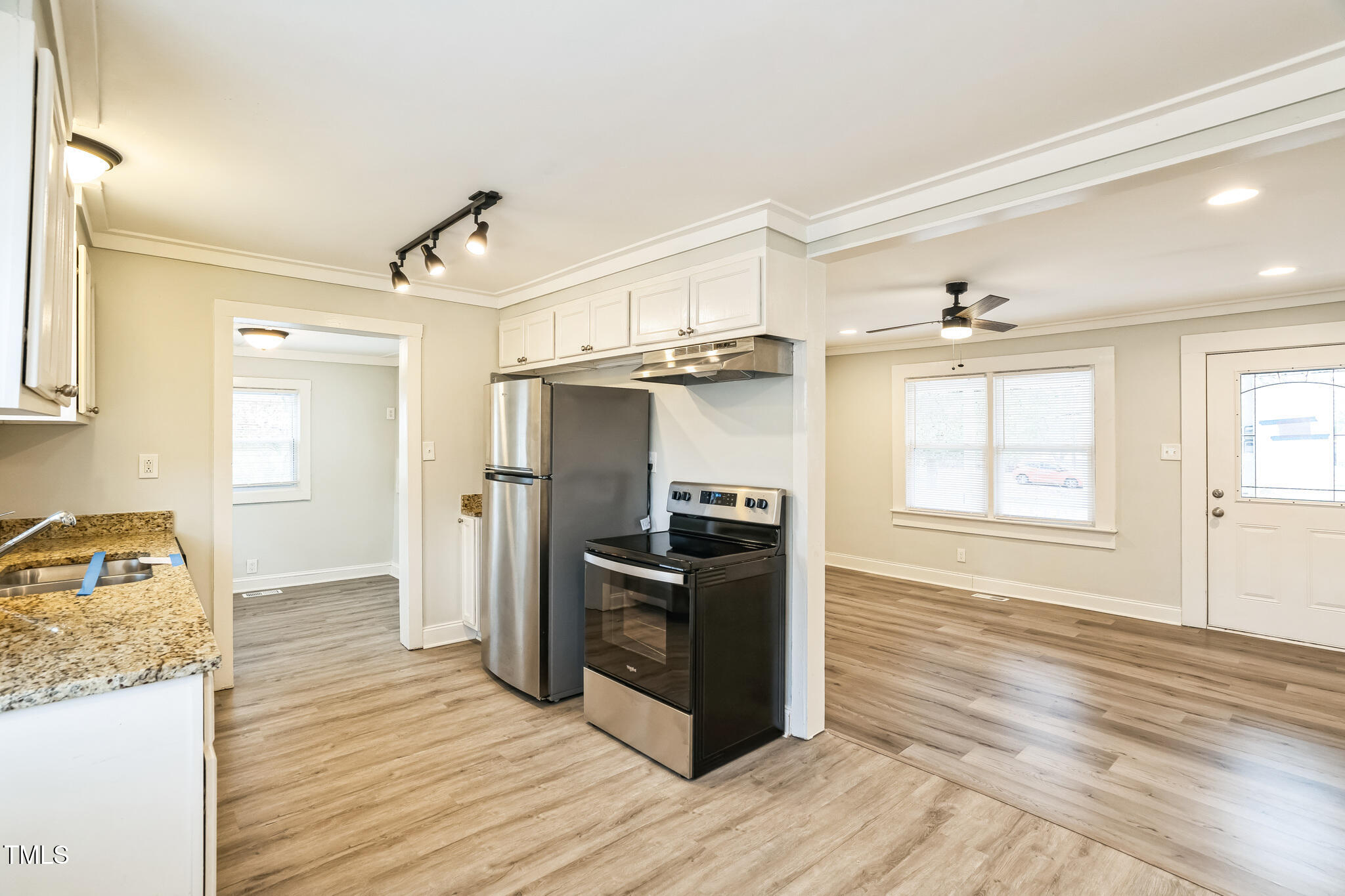 2400 Dorety Place Raleigh, NC 27604 - Photo 5 of 29 a kitchen with stainless steel appliances granite countertop a refrigerator and a stove