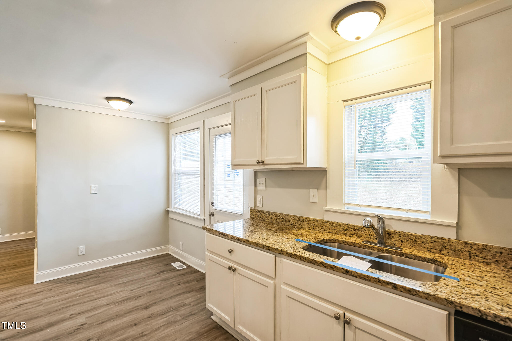 2400 Dorety Place Raleigh, NC 27604 - Photo 8 of 29 a kitchen with a sink window and cabinets