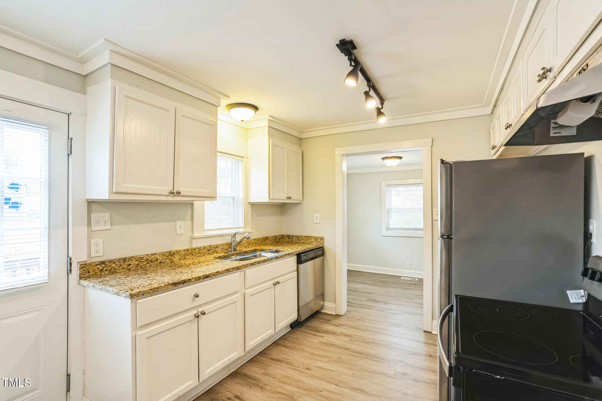 2400 Dorety Place Raleigh, NC 27604 - Photo 9 of 29 a kitchen with a sink stove and refrigerator