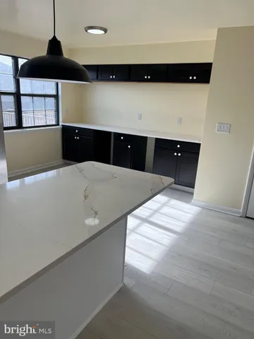 a living room with a bed and furniture