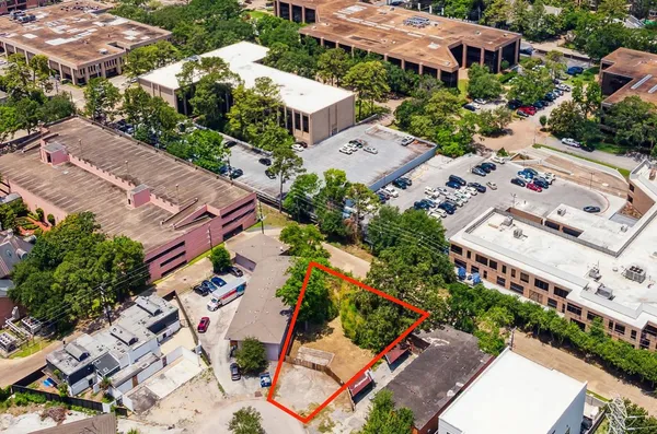 an aerial view of a house with a garden