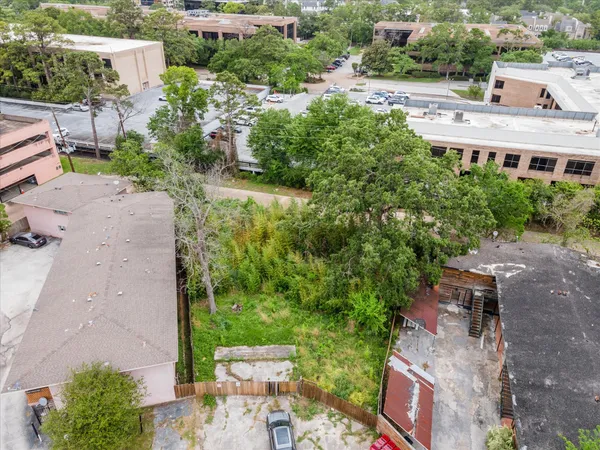 an aerial view of a house with outdoor space