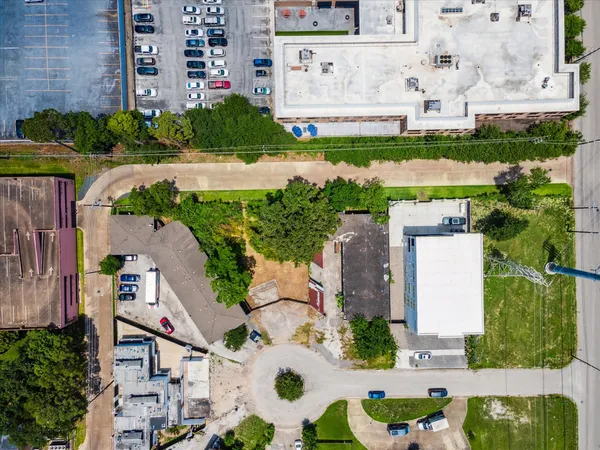 an aerial view of a house with a garden and plants