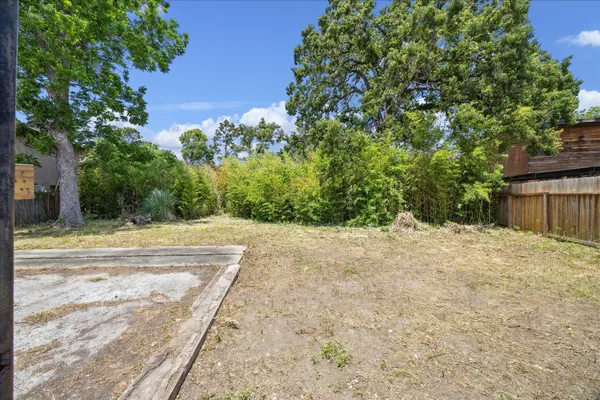 a view of a backyard of the house