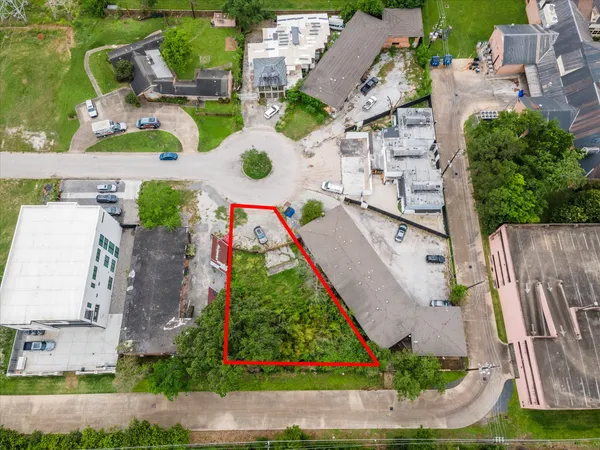 an aerial view of multiple houses with yard