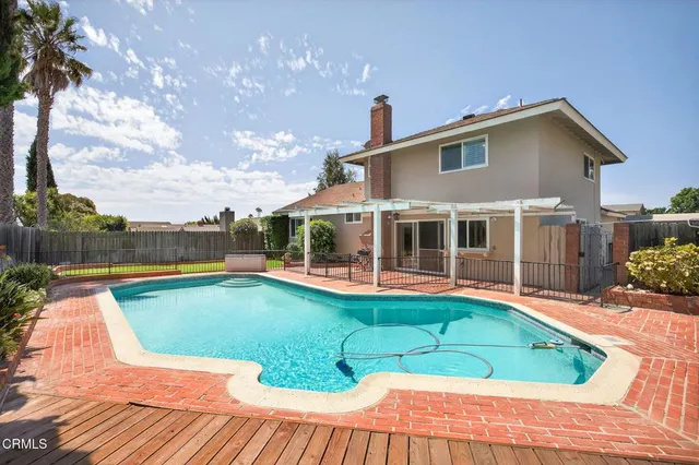 a view of a house with swimming pool