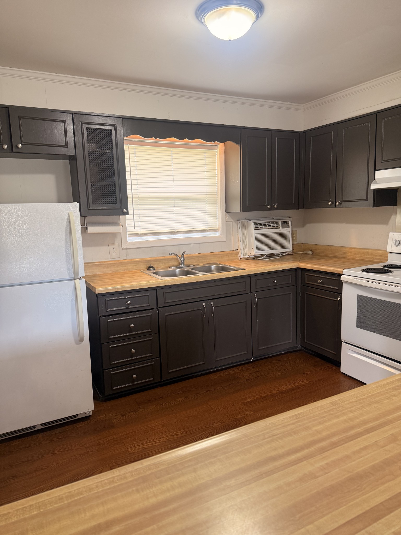 525 Walton Ferry Road, Unit B5 Hendersonville, TN 37075 - Photo 5 of 5 a kitchen with stainless steel appliances granite countertop a sink and a stove next to a large window