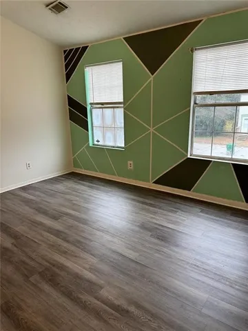 a bathroom with a sink toilet and mirror