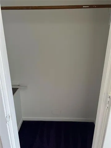 a bathroom with a granite countertop toilet sink and shower