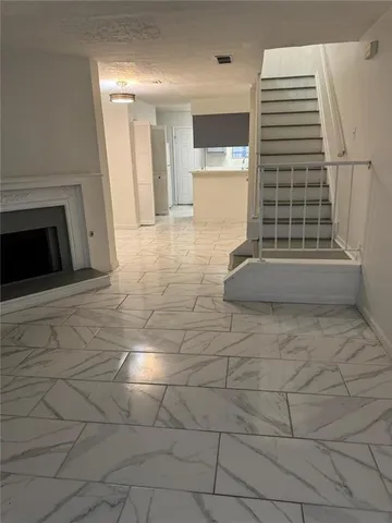 an empty room with a fireplace