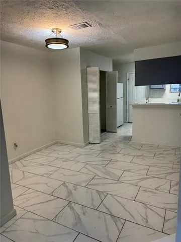 a kitchen with a sink and a stove top oven