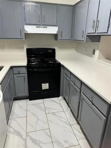 a kitchen with a cabinets and a stove