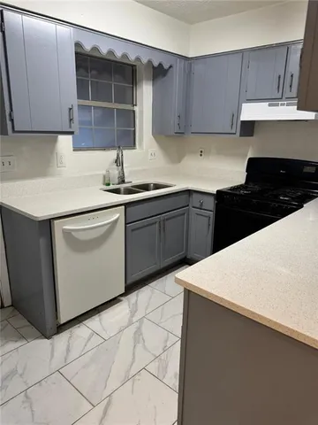 a view of a utility room and tiles