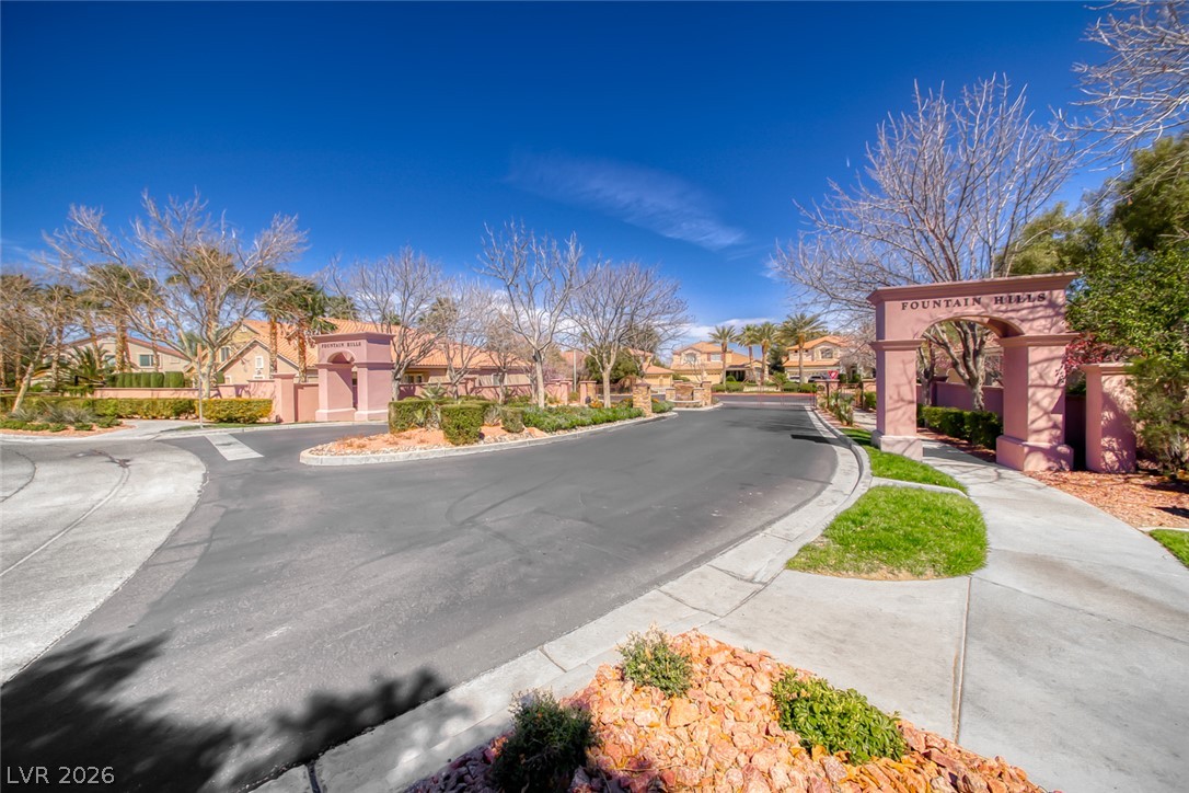 2122 Mooreview Street Henderson, NV 89012 - Photo 41 of 44 An inviting community entrance with a decorative arched sign welcomes residents into Fountain Hills.