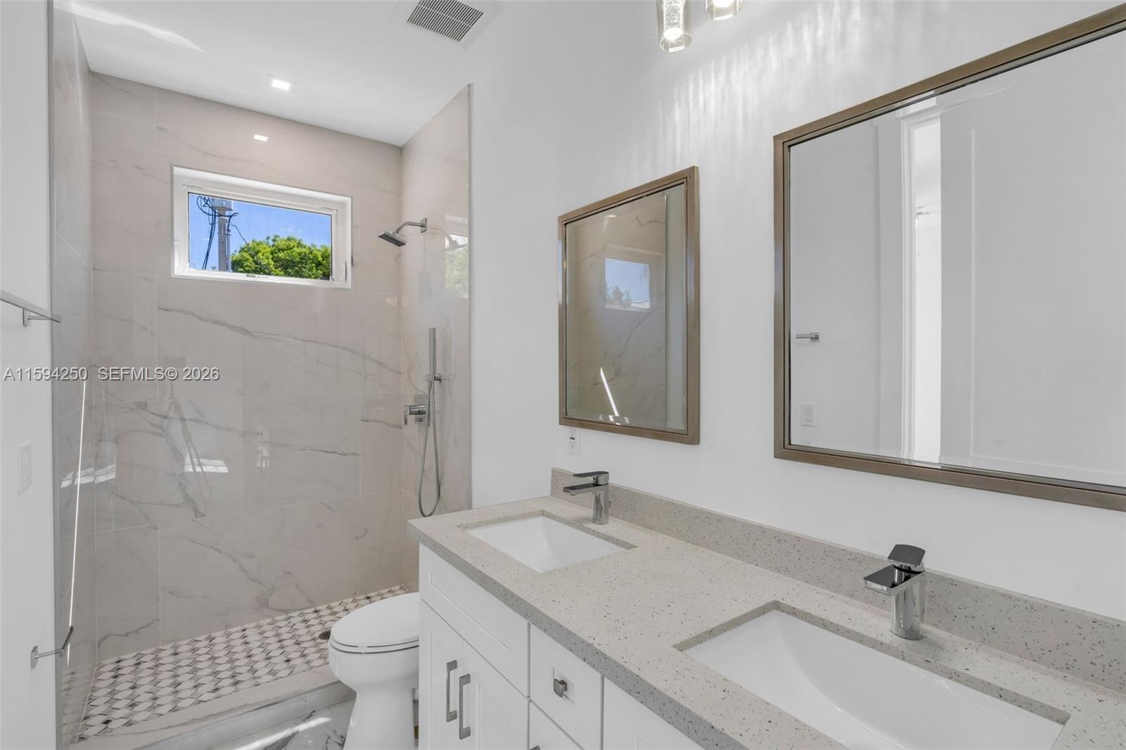 84 Coral Way Key Largo, FL 33037 - Photo 16 of 55 a bathroom with a sink a toilet and shower