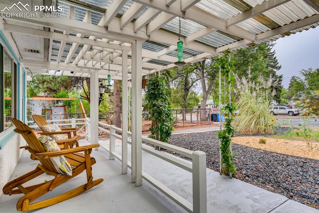 917 Prairie Road Colorado Springs, CO 80909 - Photo 2 of 27 Enjoy your oasis from the front patio
