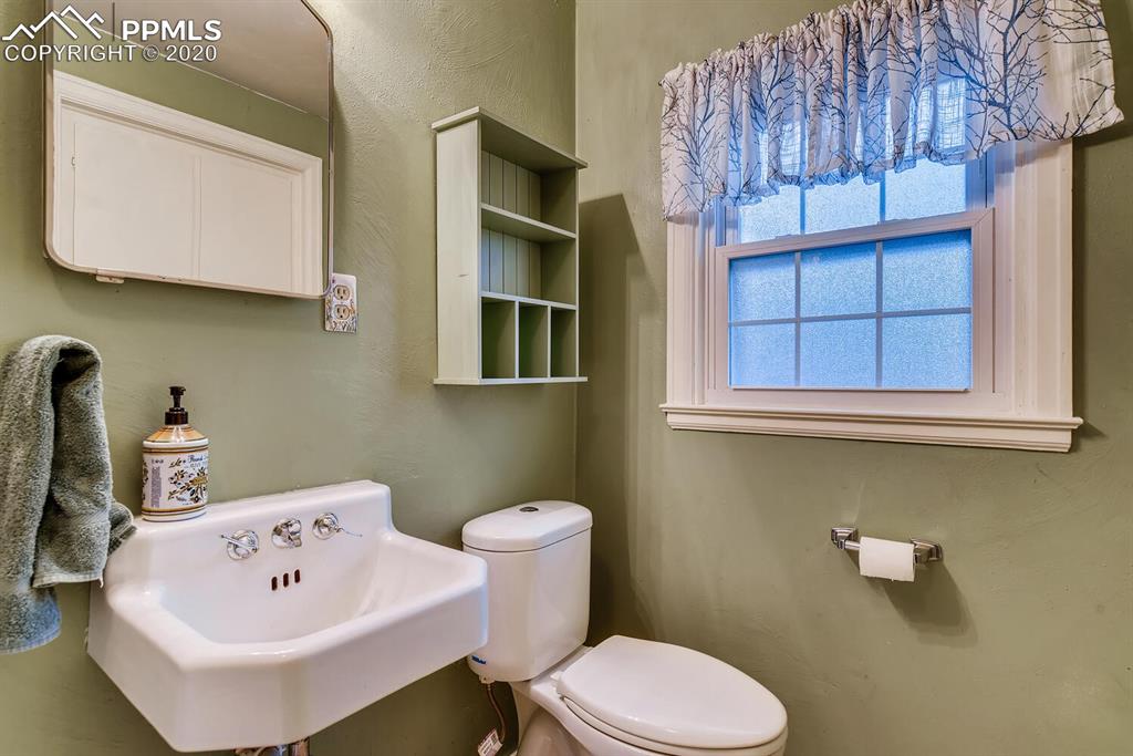 917 Prairie Road Colorado Springs, CO 80909 - Photo 13 of 27 Half bath off the kitchen