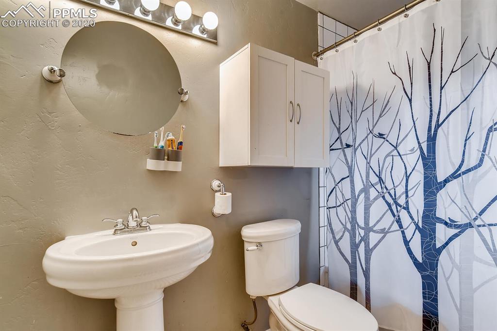 917 Prairie Road Colorado Springs, CO 80909 - Photo 16 of 27 Full bath with amazing tile work