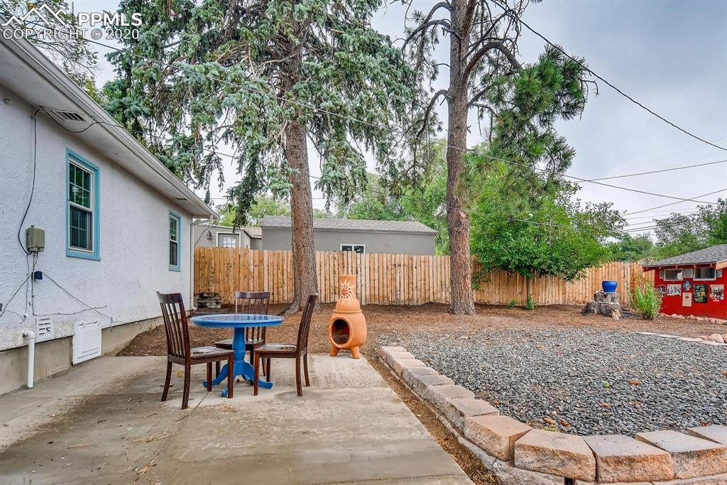 917 Prairie Road Colorado Springs, CO 80909 - Photo 19 of 27 Cement patio with gas hook up for grill connected to the house