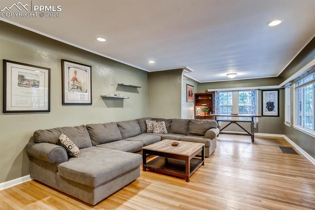 917 Prairie Road Colorado Springs, CO 80909 - Photo 4 of 27 Newly refinished hardwood floors, beautiful coved ceilings