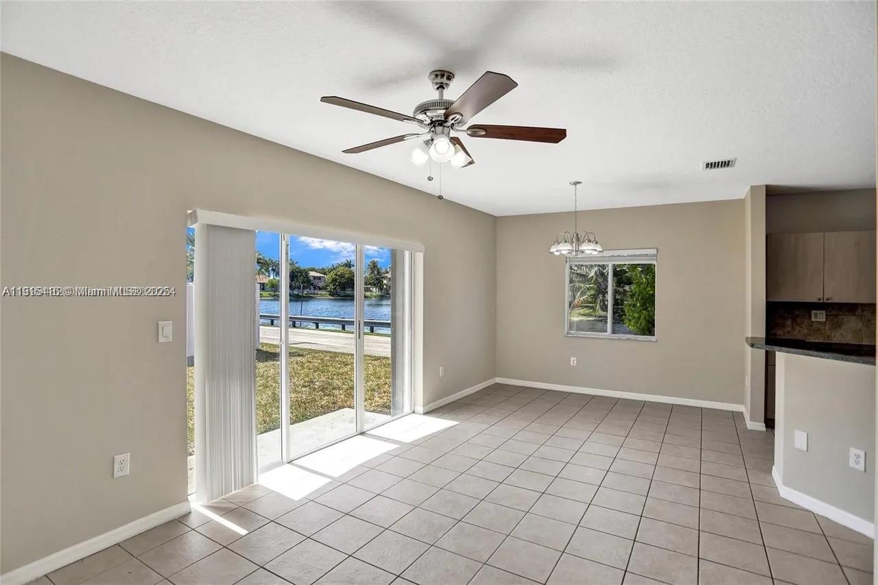 2802 Southwest 128th Way Miramar, FL 33027 - Photo 18 of 37 a view of an empty room with window and cabinet