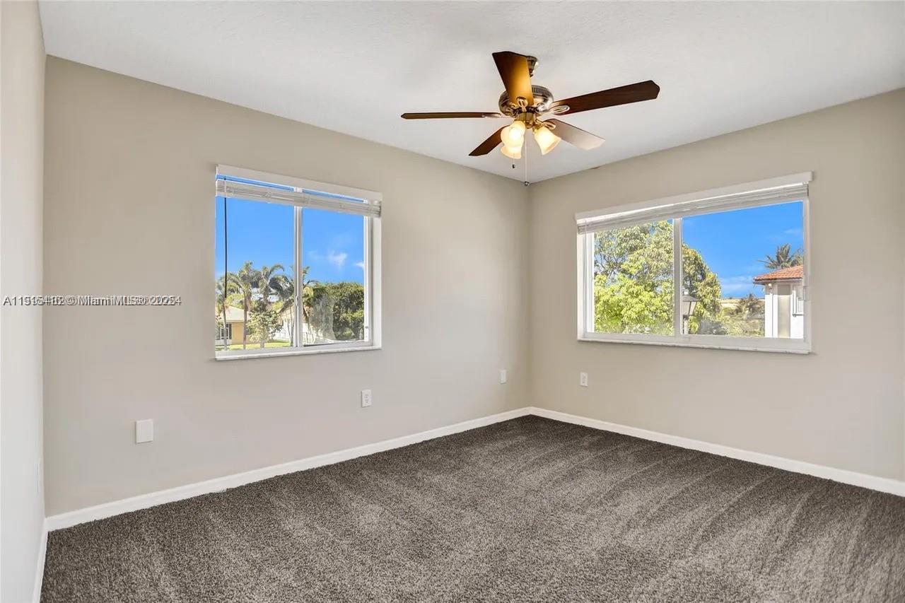 2802 Southwest 128th Way Miramar, FL 33027 - Photo 23 of 37 a view of a big room with wooden floor and windows