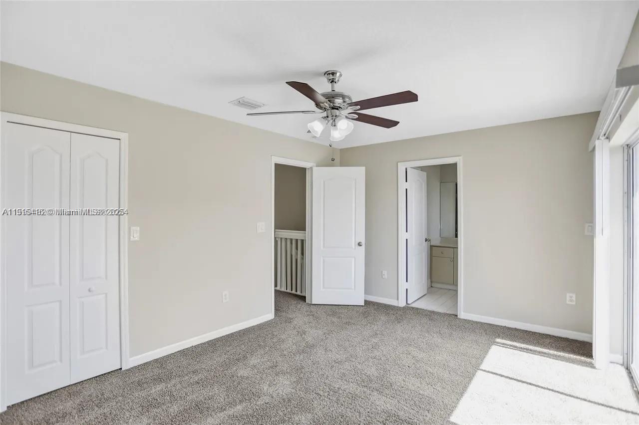 2802 Southwest 128th Way Miramar, FL 33027 - Photo 29 of 37 a view of an empty room and chandelier fan