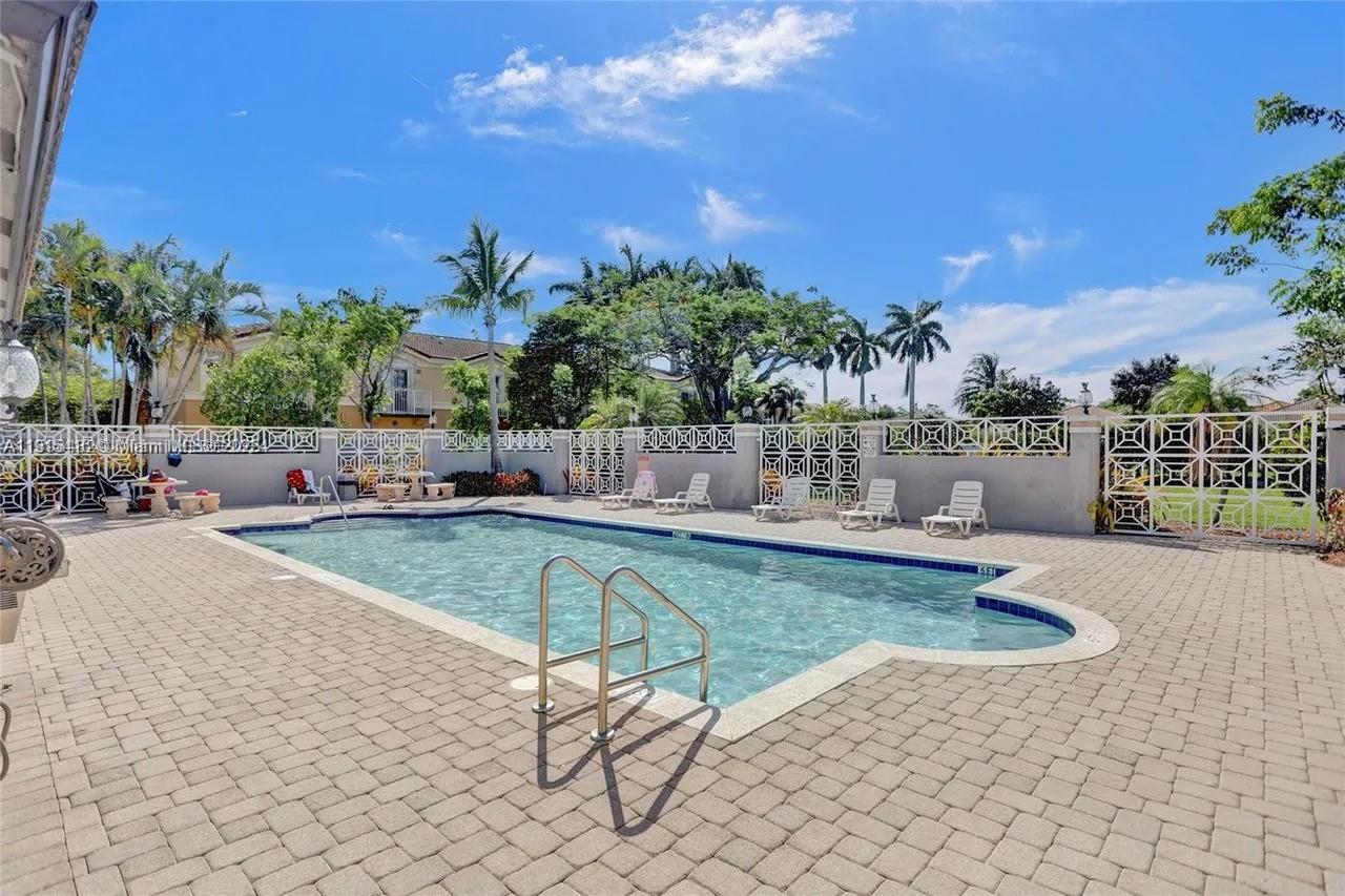 2802 Southwest 128th Way Miramar, FL 33027 - Photo 9 of 37 a view of swimming pool with outdoor seating and plants
