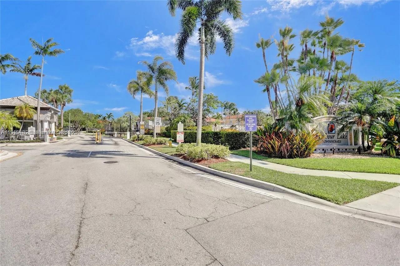 2802 Southwest 128th Way Miramar, FL 33027 - Photo 10 of 37 a view of a garden with palm trees
