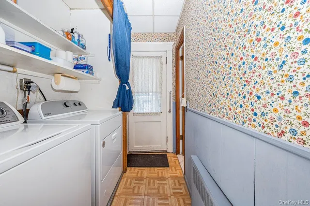 a utility room with dryer and washer