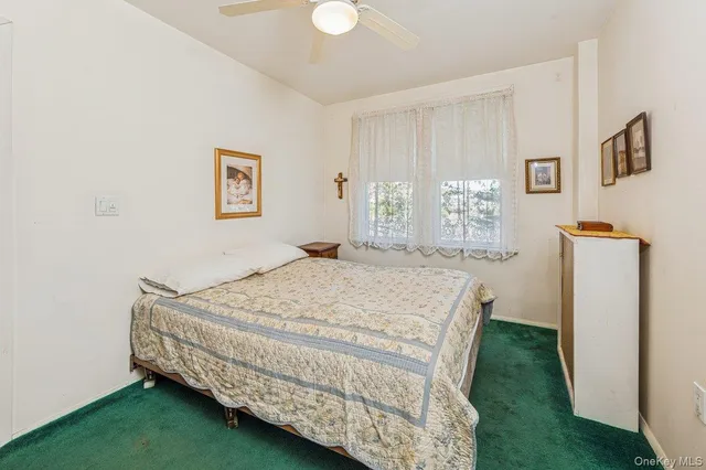 a bedroom with a bed and a cabinets