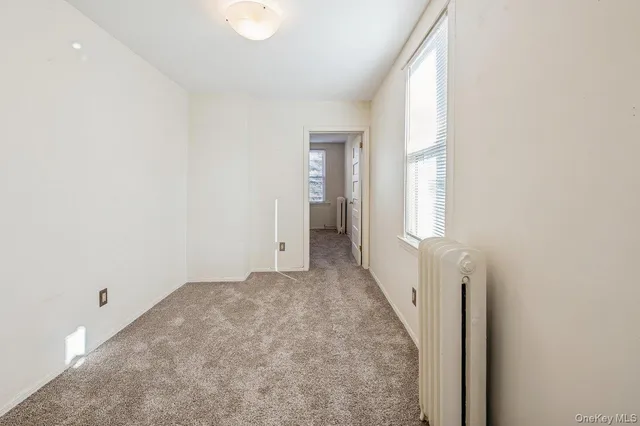 a view of a room with a hallway