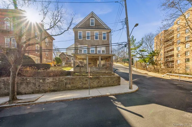 a view of a house with a street