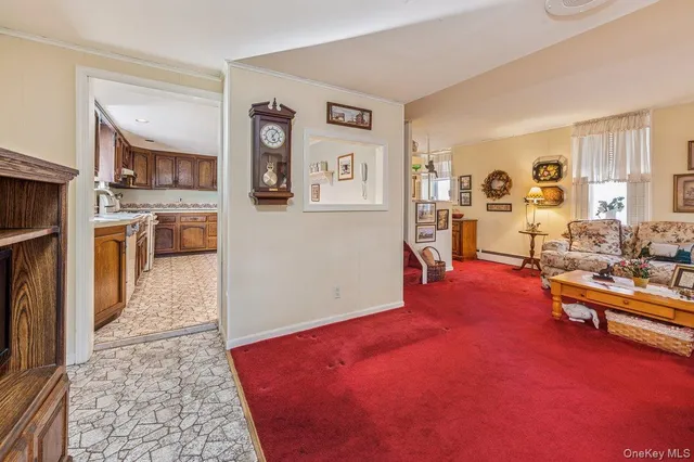 a living room with furniture and a rug