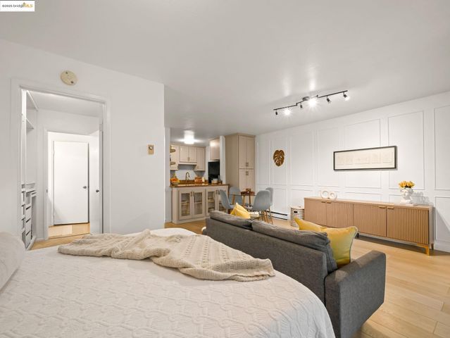 a bedroom with a bed and couch