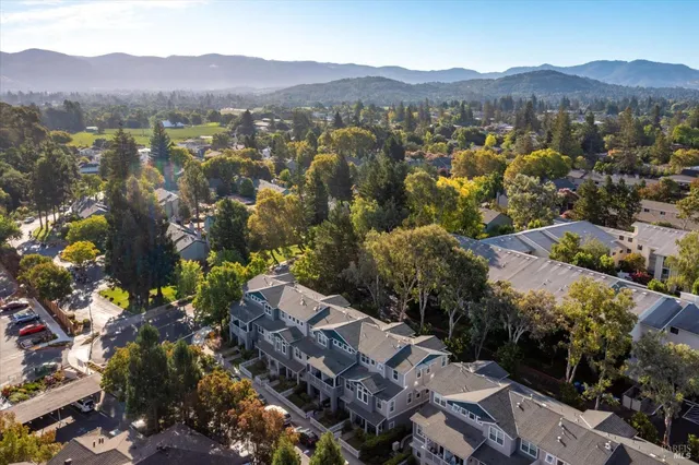 an aerial view of residential house and sandy dunes
