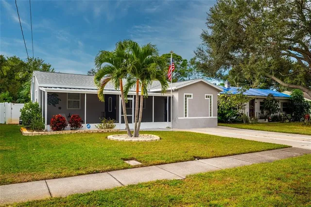 a view of a house with a yard and plants