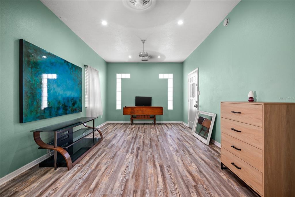 435 3rd Street Northwest Largo, FL 33770 - Photo 11 of 35 a living room with furniture and a wooden floor