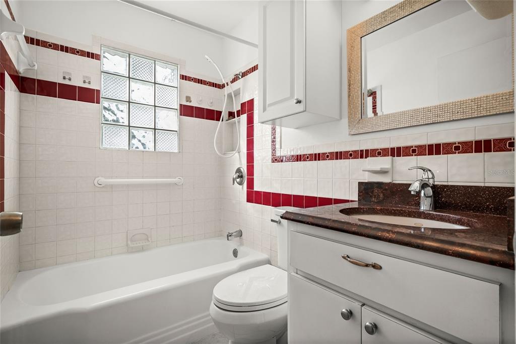 435 3rd Street Northwest Largo, FL 33770 - Photo 14 of 35 a bathroom with a sink a toilet and a bathtub