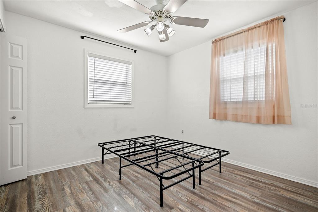 435 3rd Street Northwest Largo, FL 33770 - Photo 15 of 35 a living room with a bed furniture and a window