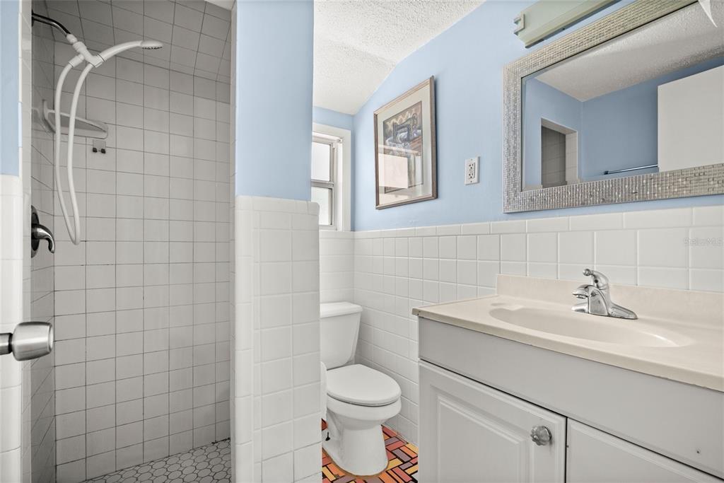 435 3rd Street Northwest Largo, FL 33770 - Photo 20 of 35 a bathroom with a sink toilet and shower