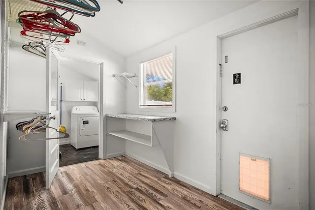 a kitchen with a refrigerator and a stove
